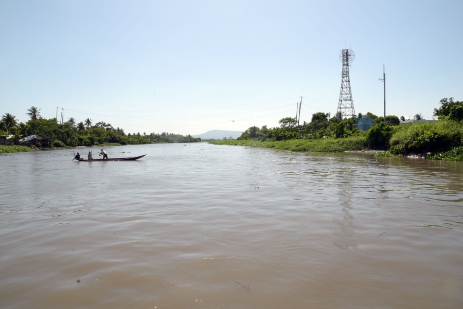 Fishermen ride canoes along parts of the Bicol river that runs along Camaligan, Camarines Sur.